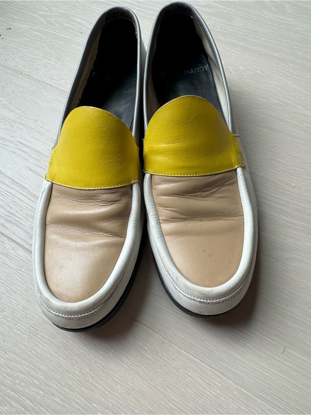 Pierre Hardy block color loafers in yellow, white beige, and purple